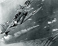 SBD-3 Dauntless bombers of VS-8 over the burning Japanese cruiser Mikuma on 6 June 1942
