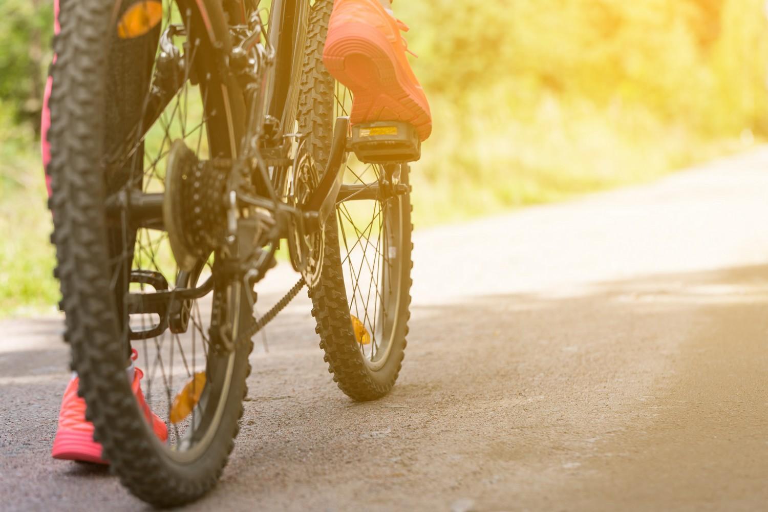 bigstock-woman-riding-a-mountain-bicycl-155609744
