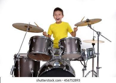 happy-young-boy-playing-drums-260nw-456752893