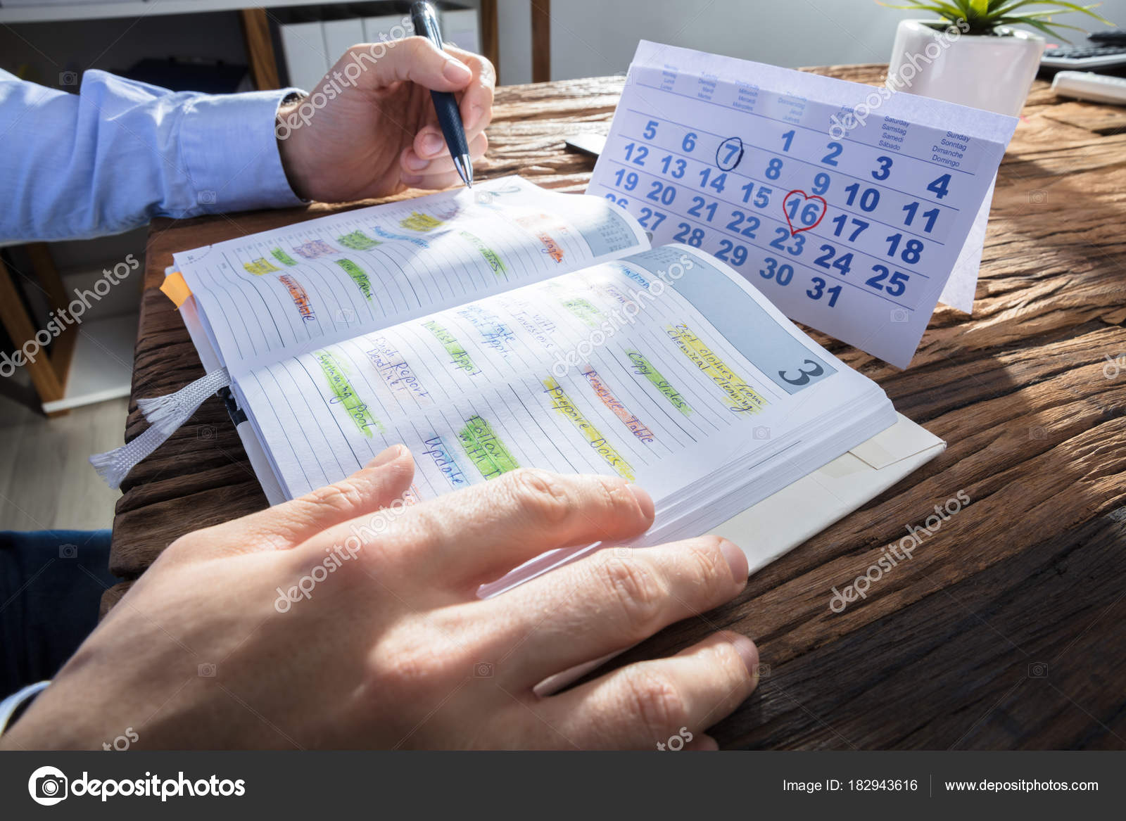 depositphotos 182943616-stock-photo-businessperson-hand-checking-schedule-diary